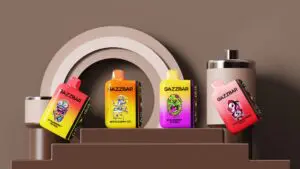 Fyra GAZZBAR vape-enheter visas på en trappa, med färgglada, tecknade zombie-tema illustrationer med smaker som Strawberry Mango, White Gummy Ice, Strawberry Banana och Tropical Rainbow Blast.